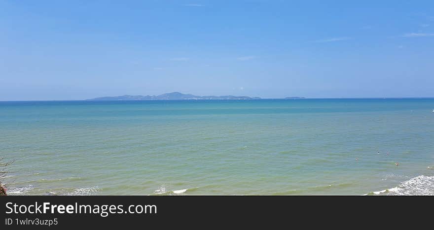 horizon seascape with clear blue sky