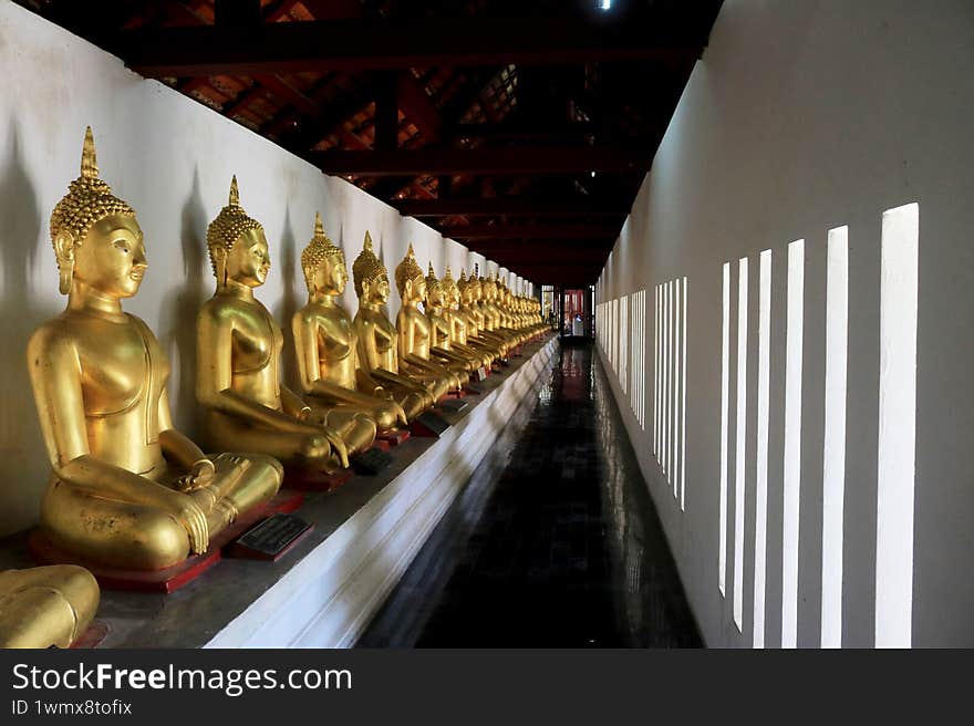 Gold buddha statues in temple Phitsanulok Thailand