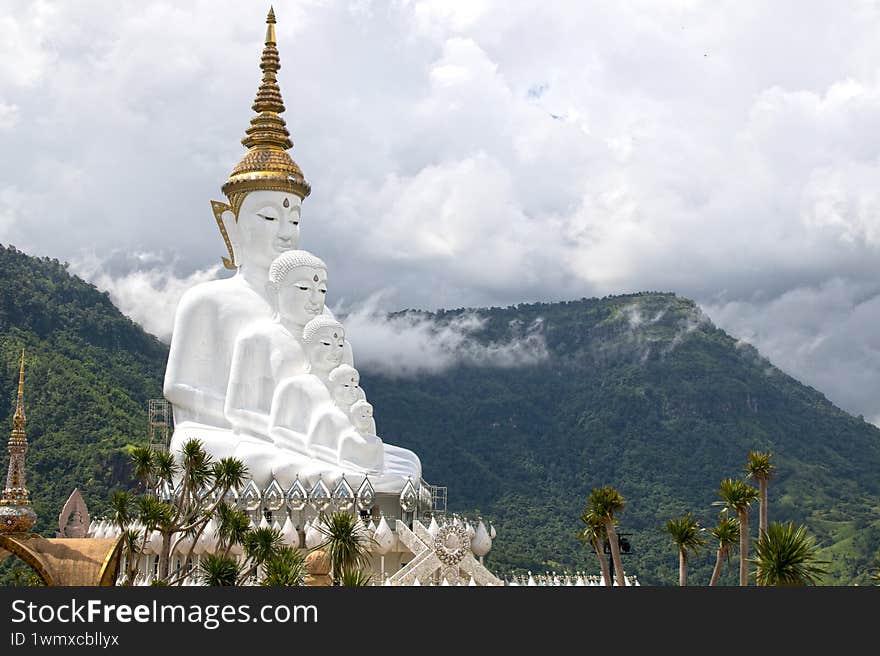 Buddha statues in front of sky in Wat Phra Thart Pha Sorn Kaew
