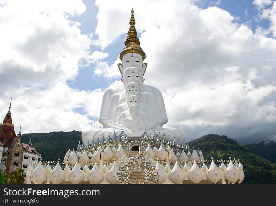 Buddha statues in front of sky in Wat Phra Thart Pha Sorn Kaew