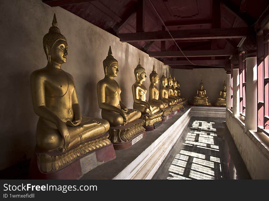 Gold buddha statues in temple Phitsanulok Thailand