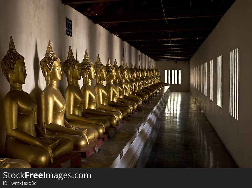 Gold buddha statues in temple Phisanulok Thailand
