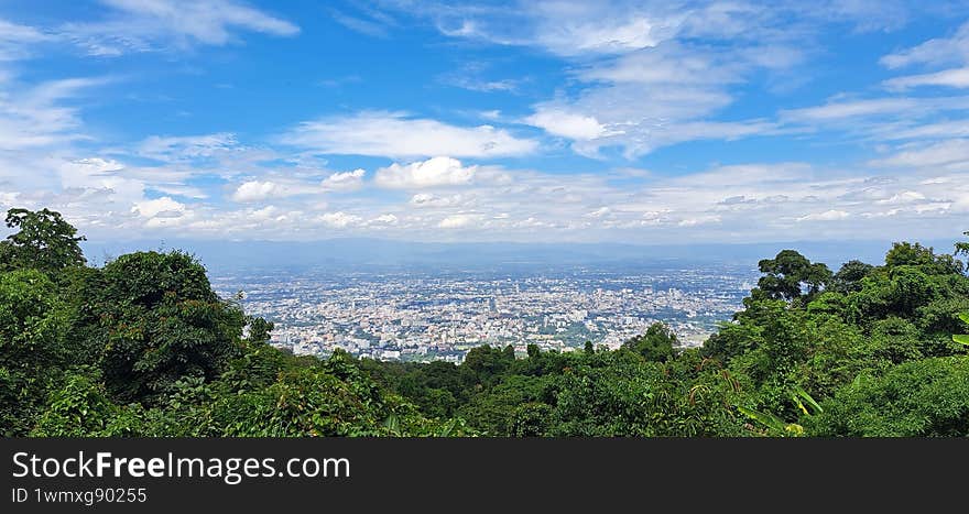 top view city behind forest of Chiang Mai Thailand
