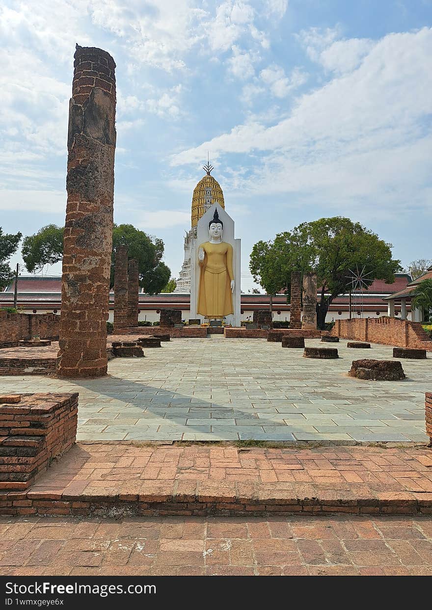 standing Buddha statue in Thai temple