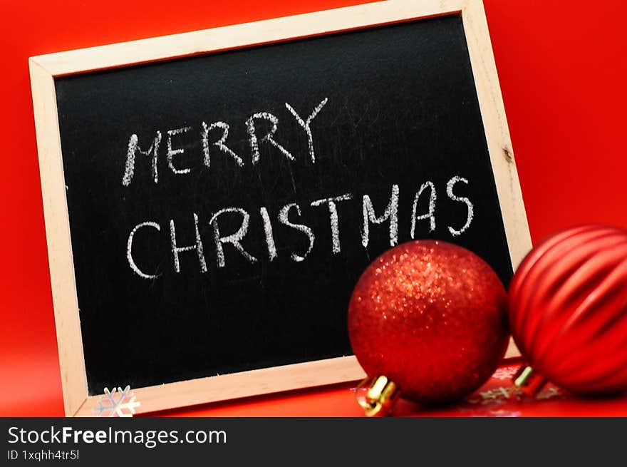 merry chrisstmas write between christmas decorations