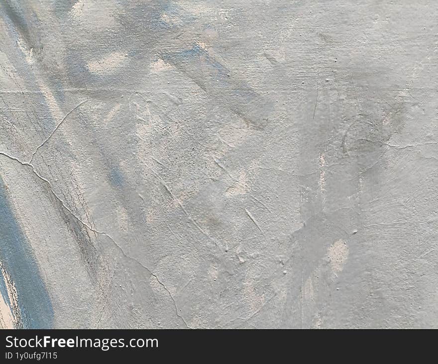 Gray cement plaster wall texture with cracks and trowel marks