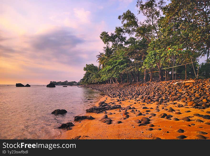 Stony beach during the sunset in Pandeglang of Banten Province in Indonesia.
