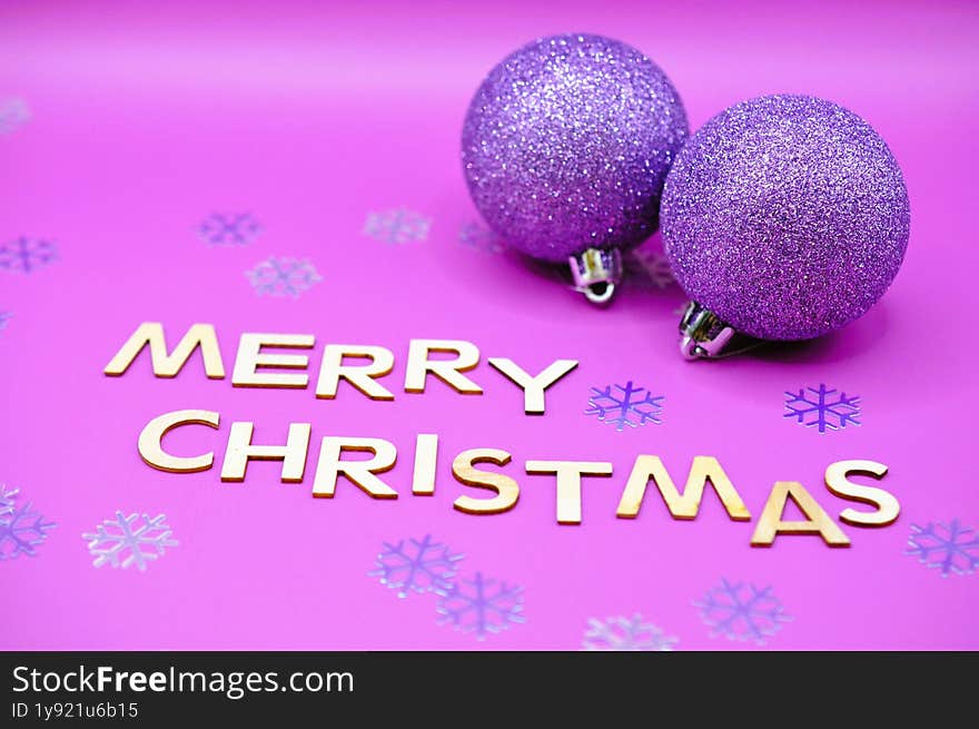 merry christmas write next to christmas balls
