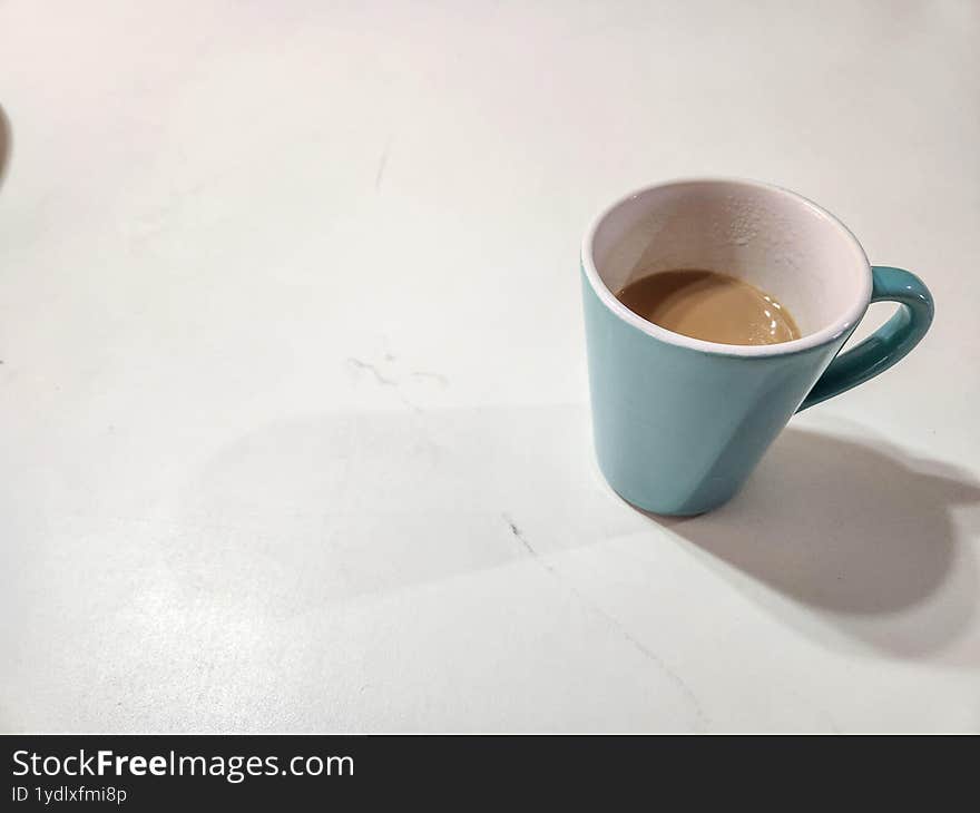 Coffee cup on a white table