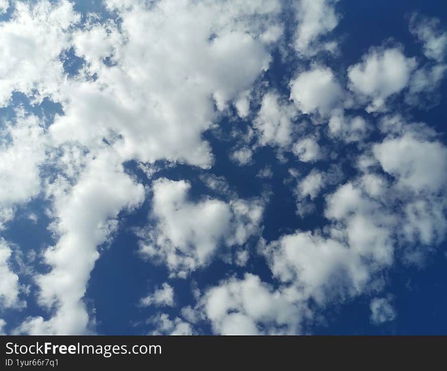 Blue sky with white clouds in autumn day