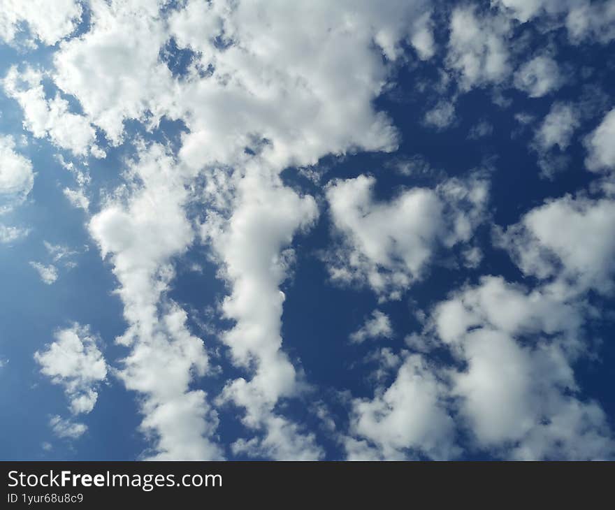 Blue sky with white clouds in autumn day