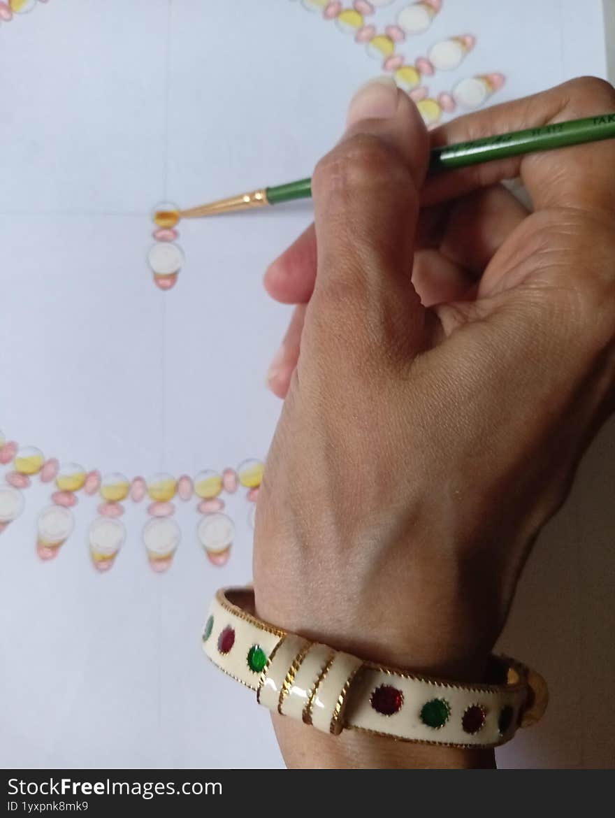 A jewellery designer skillfully creates intricate sketches that bring unique jewellery concepts to life. A jewellery designer skillfully creates intricate sketches that bring unique jewellery concepts to life.