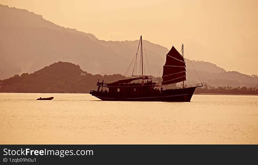 Sunset among the misty hills of the tropical island