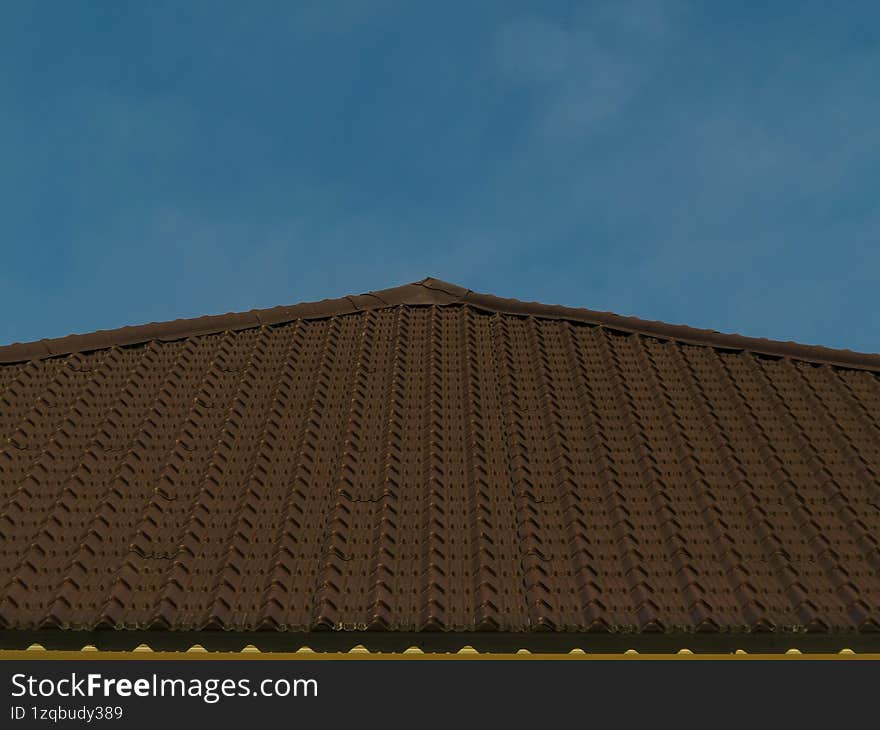 Building roof with blue sky background