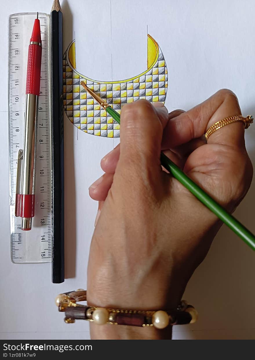A jewellery designer skillfully creates intricate sketches that bring unique jewellery concepts to life. A jewellery designer skillfully creates intricate sketches that bring unique jewellery concepts to life.