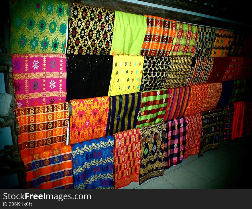 A display of woven fabrics in a village on Lombok Island, Indonesia