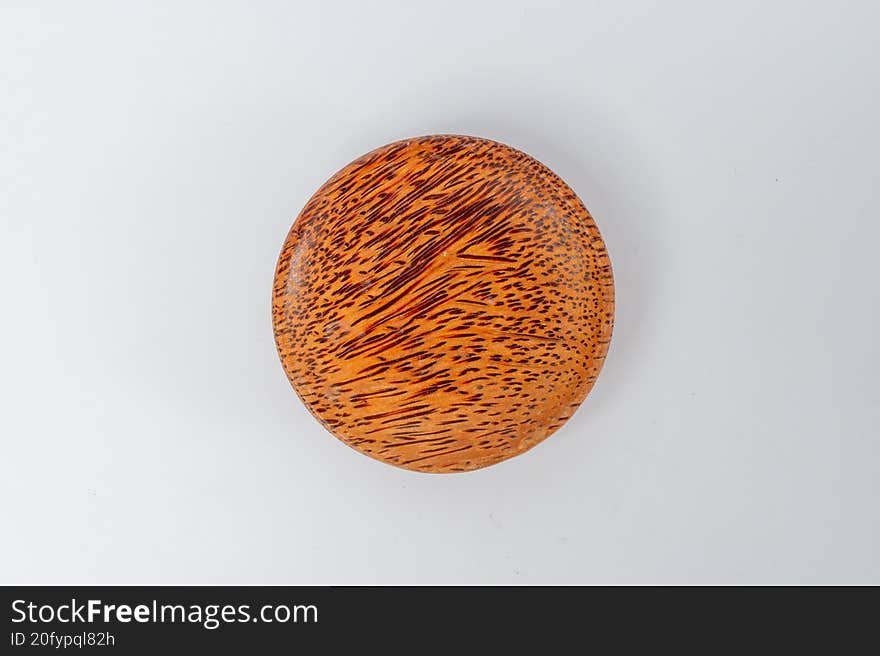 Top view small wooden textured bowl on white