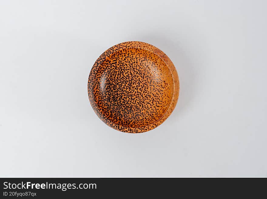 Top view round textured wooden bowl on white background