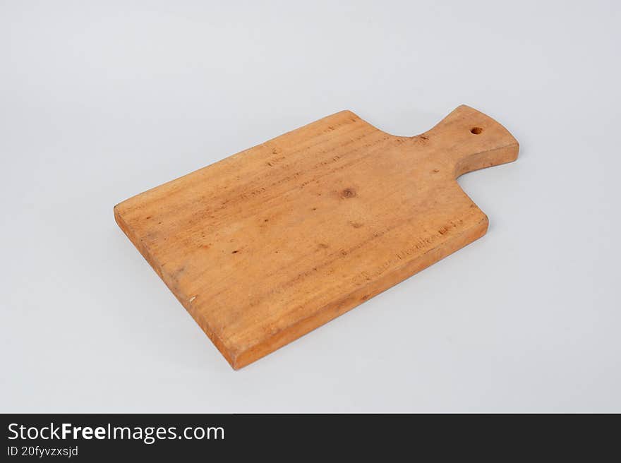 Wooden cutting board on white background