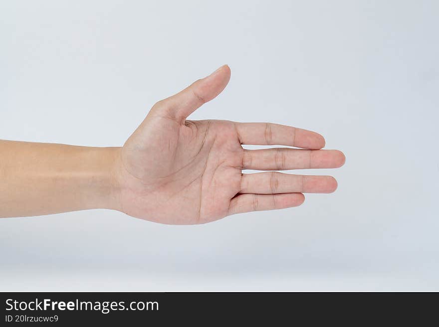 Hand showing open palm gesture on white