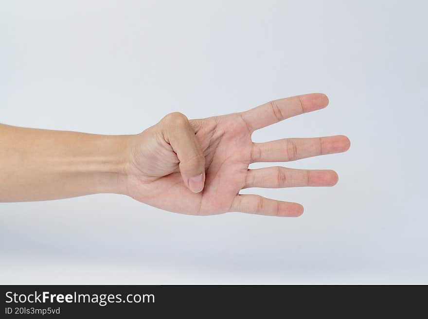 Hand showing four fingers gesture on white