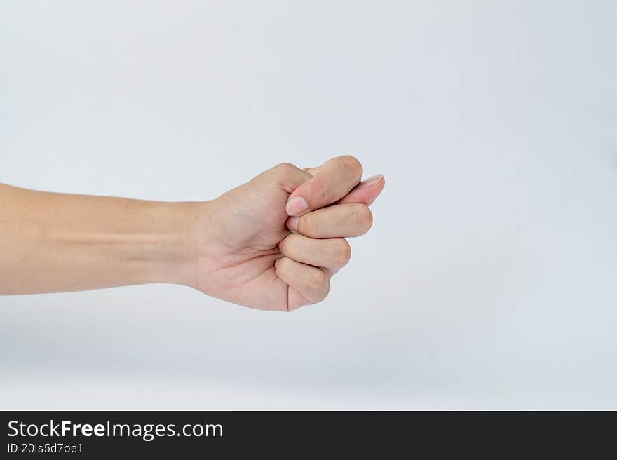Hand showing crossed fingers gesture on white