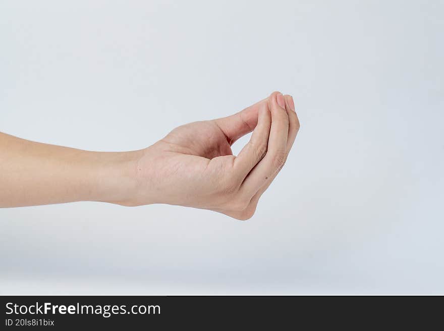 Hand showing pinch gesture on white background