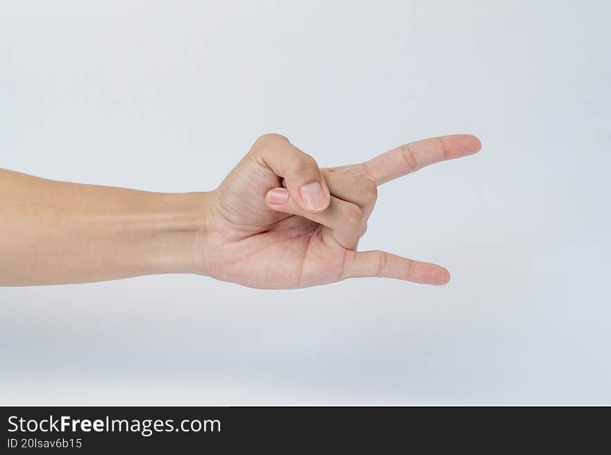 Hand making horn sign gesture on white
