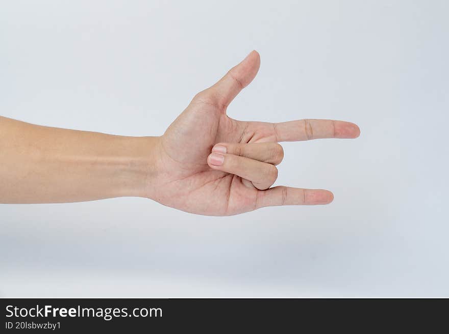 Hand showing rock gesture on white background