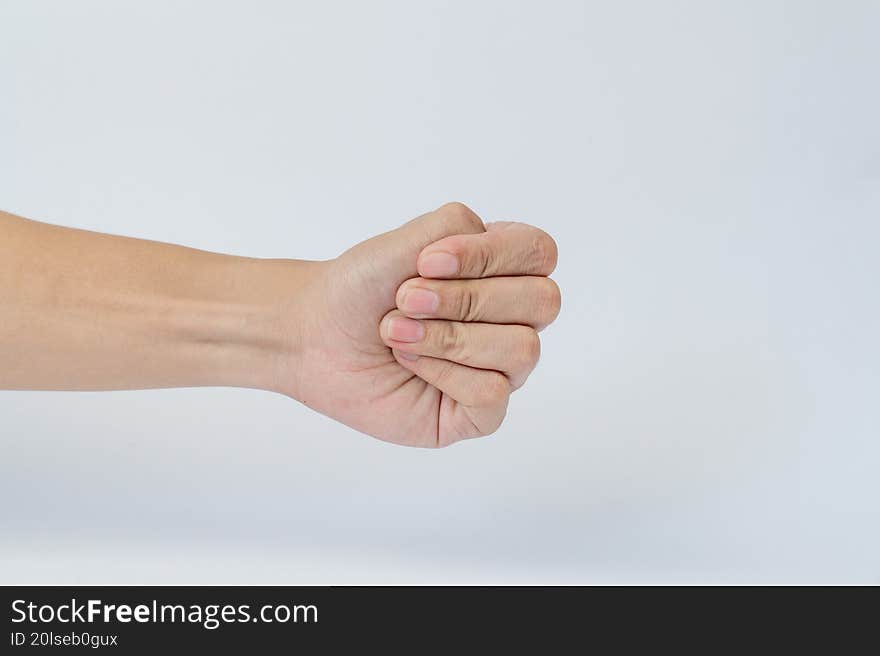 Hand making closed fist gesture on white