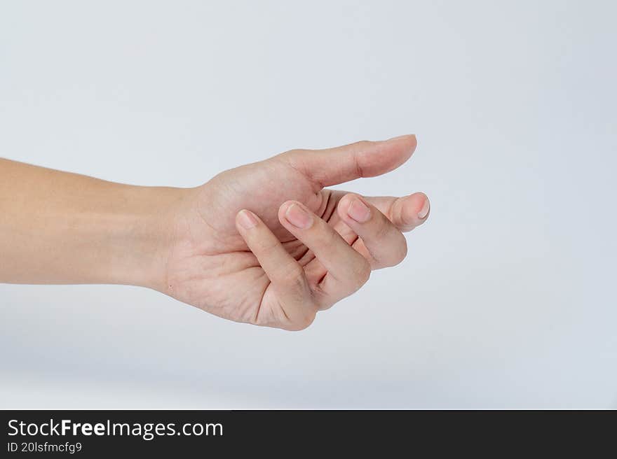 Hand showing finger cross gesture on white