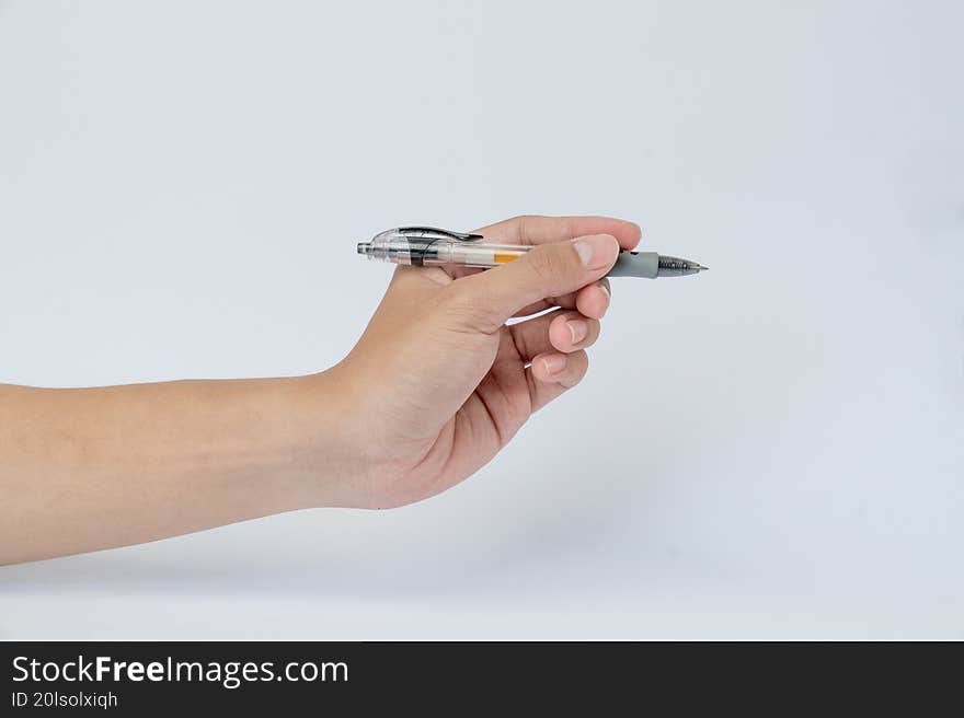 Hand holding pen ready to write on white background