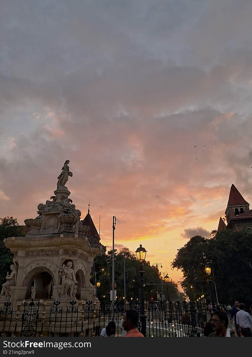 the marble historical monument of bombay, as seen during a sunset