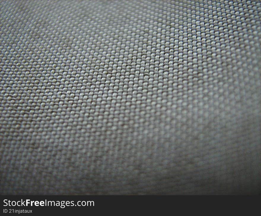 deep threading work visible of a cotton garment , macro shot