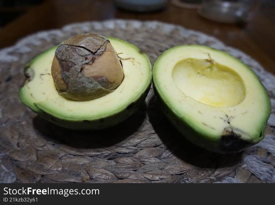 The avocado fruit cut in half looks fresh and delicious