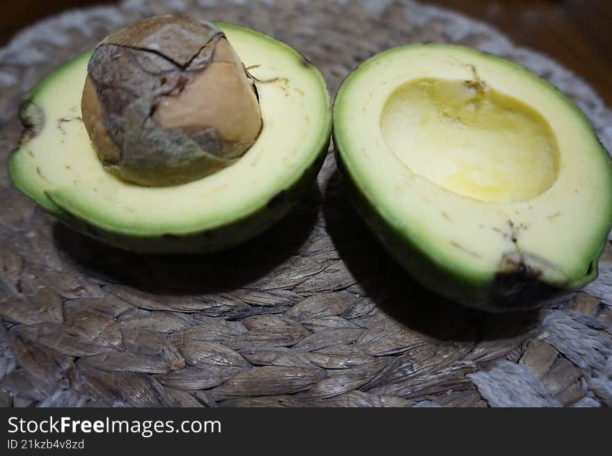 The avocado fruit cut in half looks fresh and delicious