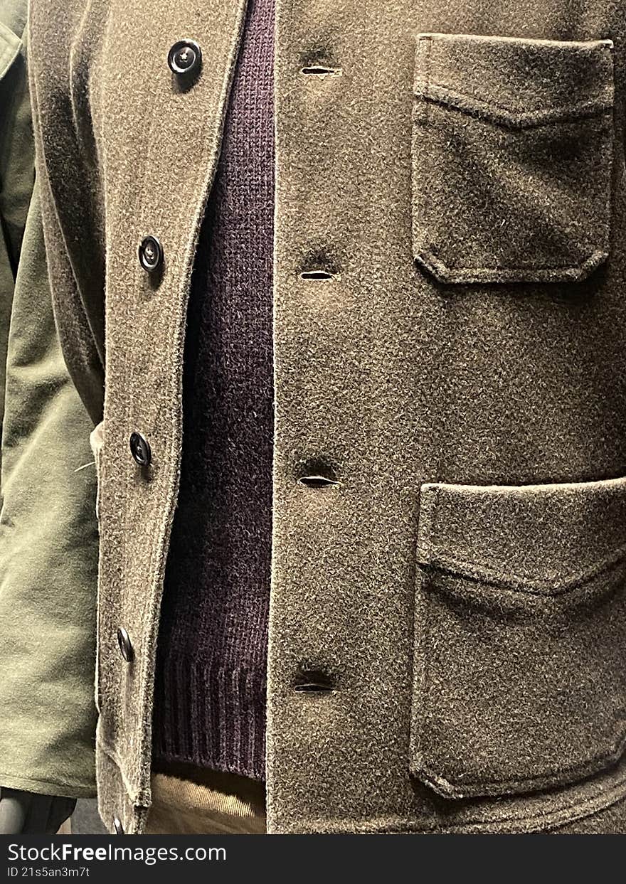 brown men's suit with two pockets and buttons