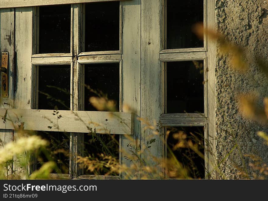 Wooden window in old abandoned house