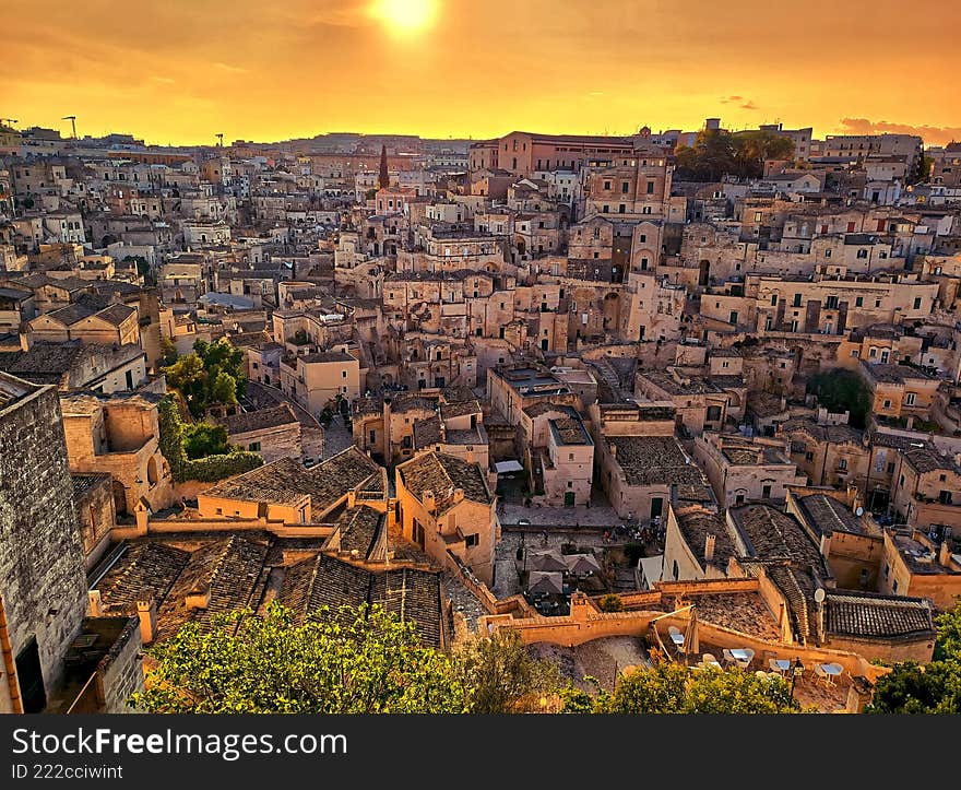 Matera at sunset, where the buildings are illuminated. Matera at sunset, where the buildings are illuminated.