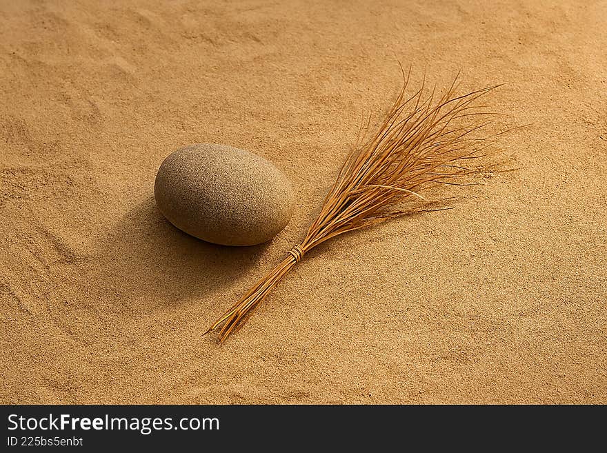 A calming still life featuring a smooth stone and a bundle of wheat resting on a textured, neutral-toned surface, evoking a sense of peace and simplicityCreated AI. A calming still life featuring a smooth stone and a bundle of wheat resting on a textured, neutral-toned surface, evoking a sense of peace and simplicityCreated AI