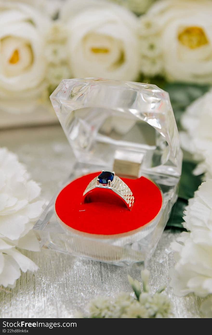 A luxury men s silver ring with a large blue sapphire gemstone