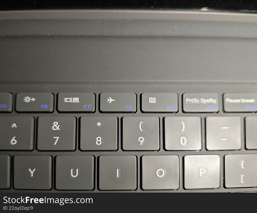 Close up of a Modern Laptop Keyboard with Backlit Function and Alphanumeric Keys