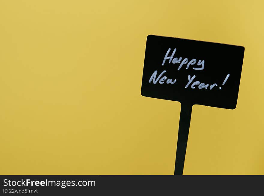 Happy New Year sign in yellow background