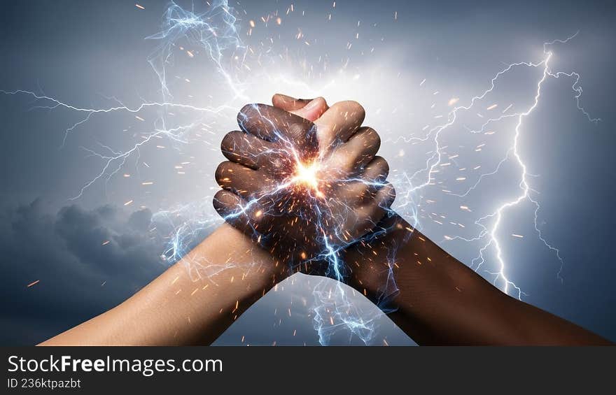 The image depicts a pair of hands reaching towards each other amidst a dramatic backdrop of lightning bolts. The hands appear to be generating or controlling electrical energy, with sparks and light emanating from their touch. The scene is set against a dark, stormy sky, emphasizing the power and intensity of the moment. The image depicts a pair of hands reaching towards each other amidst a dramatic backdrop of lightning bolts. The hands appear to be generating or controlling electrical energy, with sparks and light emanating from their touch. The scene is set against a dark, stormy sky, emphasizing the power and intensity of the moment