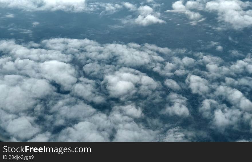 The Infinite Azure: A View Above the Clouds