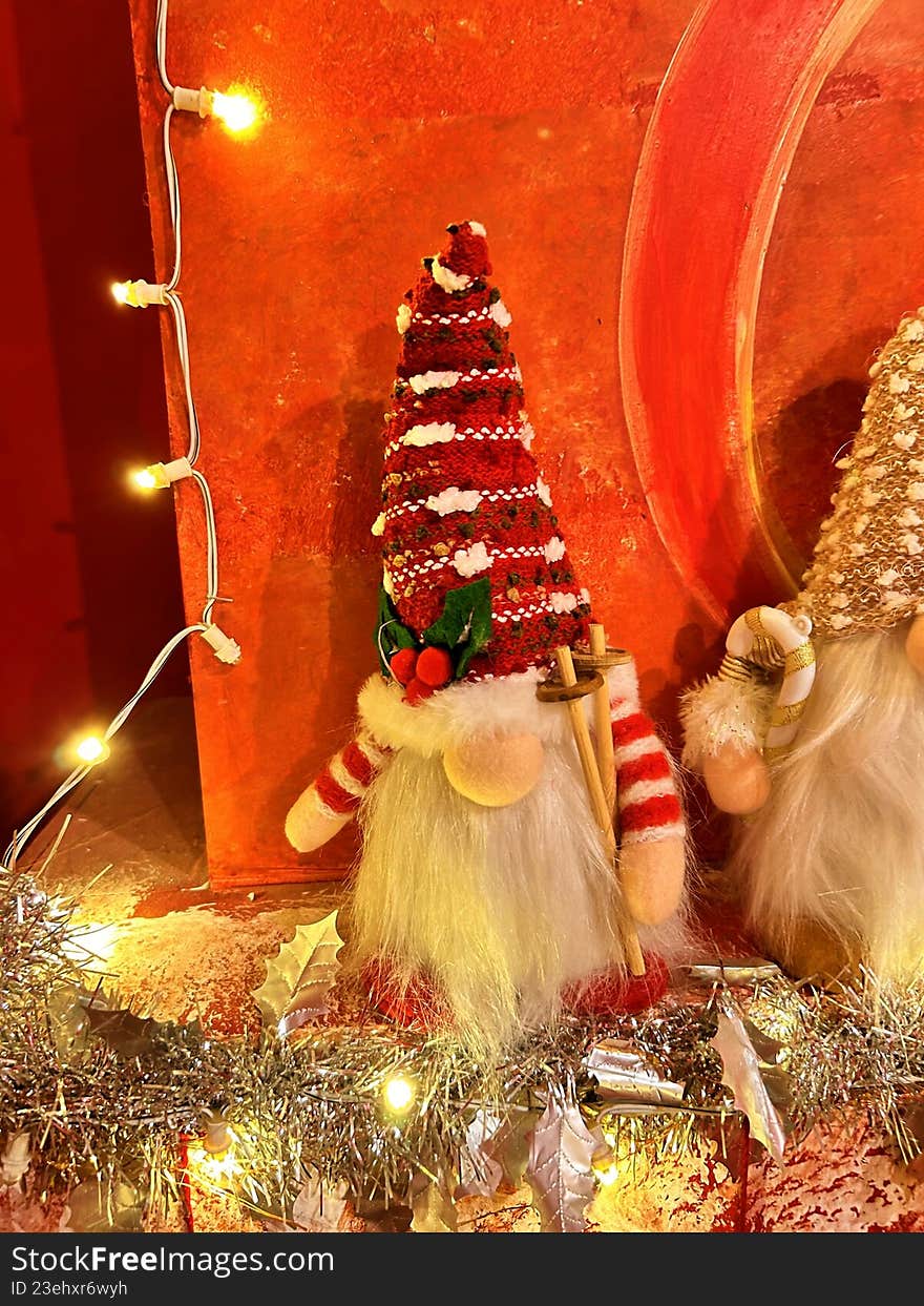 Festive Christmas gnome decoration with red hat and warm lights, adding a cozy and cheerful holiday atmosphere.