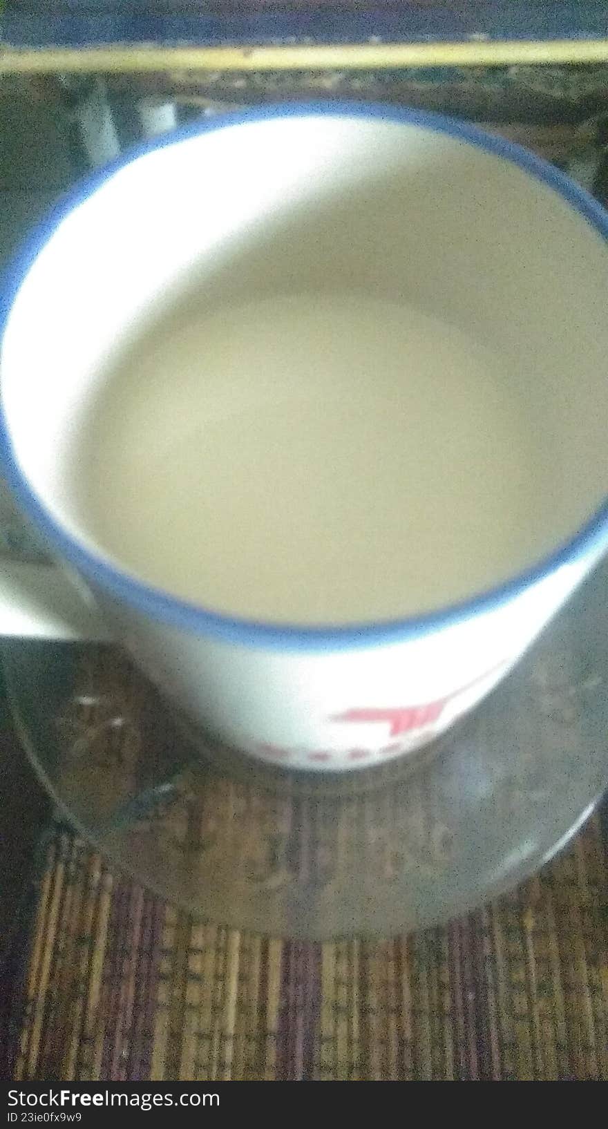 a cup of leftover white milk drink on the work table
