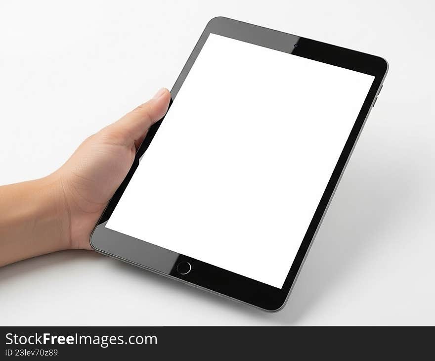 Hand interacting with tablet device