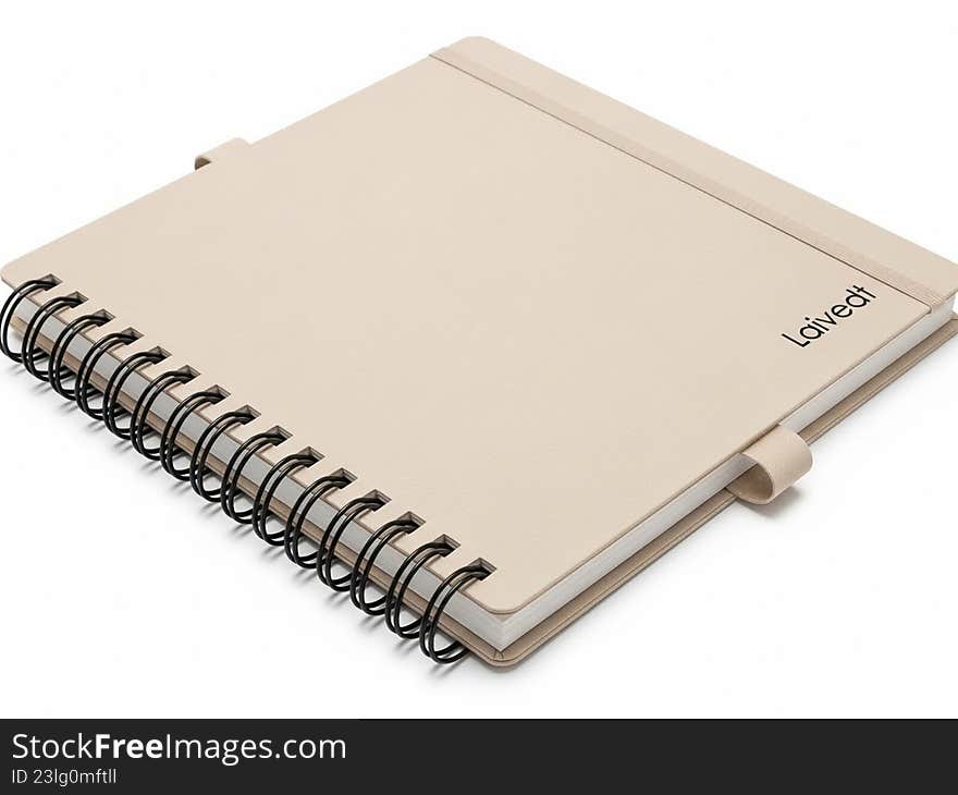 The image depicts a spiral-bound notebook with a beige cover. The notebook is closed and features a simple, elegant design. The brand name 'Liviri' is subtly printed on the cover. The spiral binding is visible on the left side, allowing the pages to be easily flipped open. The notebook appears to be of high quality, suitable for note-taking, journaling, or sketching. The image depicts a spiral-bound notebook with a beige cover. The notebook is closed and features a simple, elegant design. The brand name 'Liviri' is subtly printed on the cover. The spiral binding is visible on the left side, allowing the pages to be easily flipped open. The notebook appears to be of high quality, suitable for note-taking, journaling, or sketching