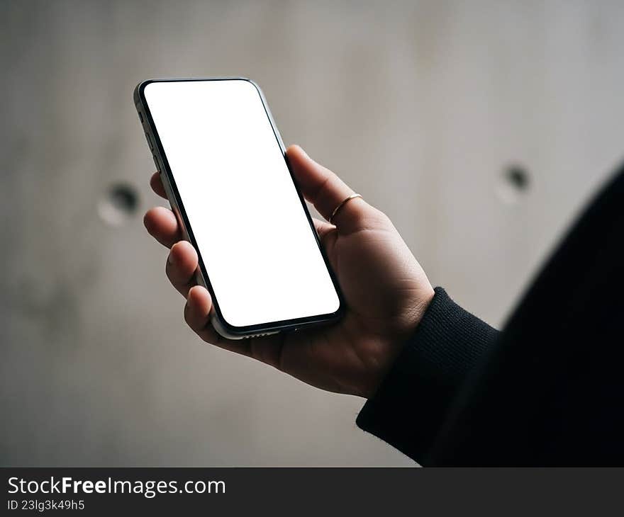 Hand holding blank smartphone